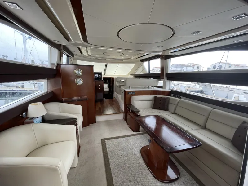 Slide: The Image of Luxurious interior of 2011 Meridian 441 Sedan Bridge yacht with elegant seating and wood accents. - 3
