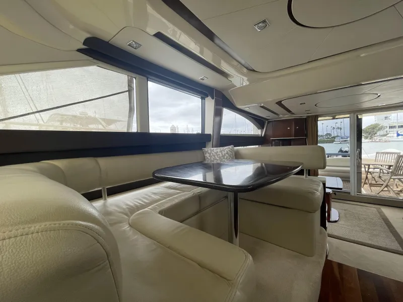 Slide: The Image of Luxurious interior of 2011 Meridian 441 Sedan Bridge yacht with elegant seating and table. - 6