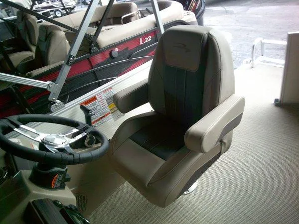 Slide: The Image of 2024 Bennington 20SLX boat interior with captain's chair and steering wheel. - 3