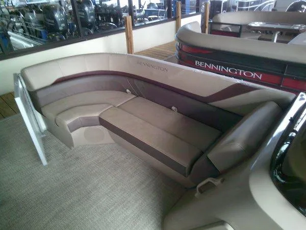 Slide: The Image of 2024 Bennington 20SLX pontoon boat interior with plush seating and modern design. - 7