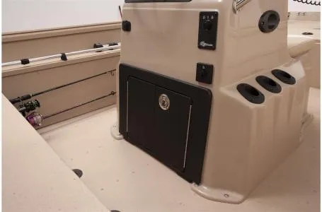 Slide: The Image of 2021 G3 Bay 17 boat interior with rod holders and storage compartment. - 16