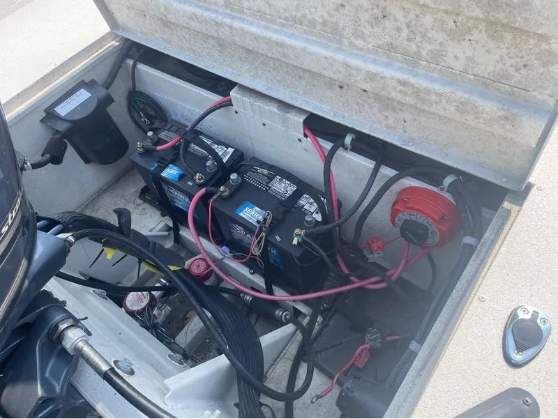 Slide: The Image of Open battery compartment of 2021 G3 Bay 17 boat with wiring and components. - 8