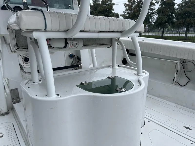 Slide: The Image of 2008 Triumph 215 CC boat interior with seating and storage compartment. - 4