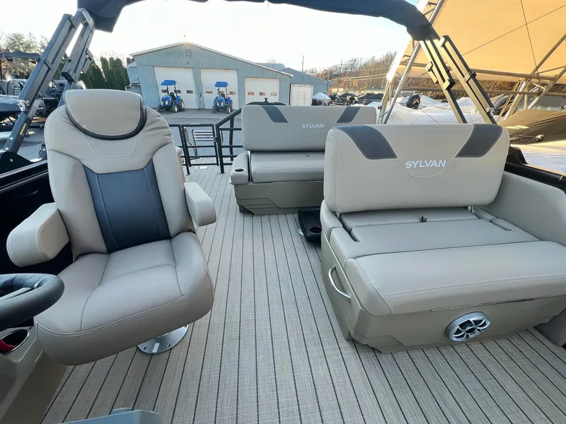 Slide: The Image of 2025 Sylvan L1 DLZ boat interior with beige seating and modern design. - 16