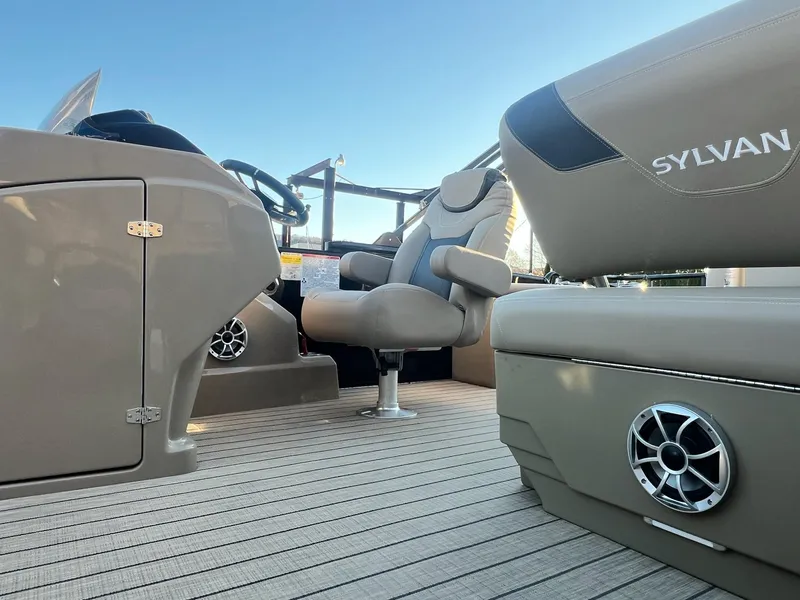 Slide: The Image of 2025 Sylvan L1 DLZ boat interior with beige seating and modern design. - 18