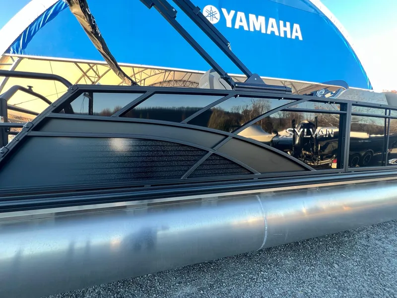 Slide: The Image of 2025 Sylvan L1 DLZ pontoon boat displayed under Yamaha canopy. - 19