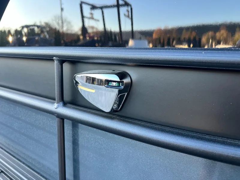 Slide: The Image of Close-up of 2025 Sylvan L1 DLZ boat detail with sleek chrome accent. - 22