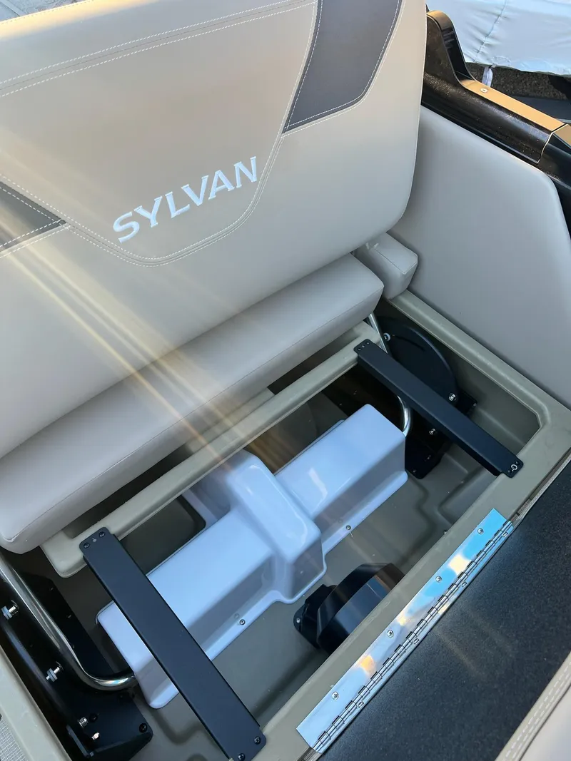 Slide: The Image of 2025 Sylvan L1 DLZ boat seat with storage compartment, sunlight highlighting details. - 31