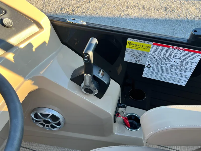 Slide: The Image of 2025 Sylvan L1 DLZ boat control panel with throttle and safety warnings. - 32