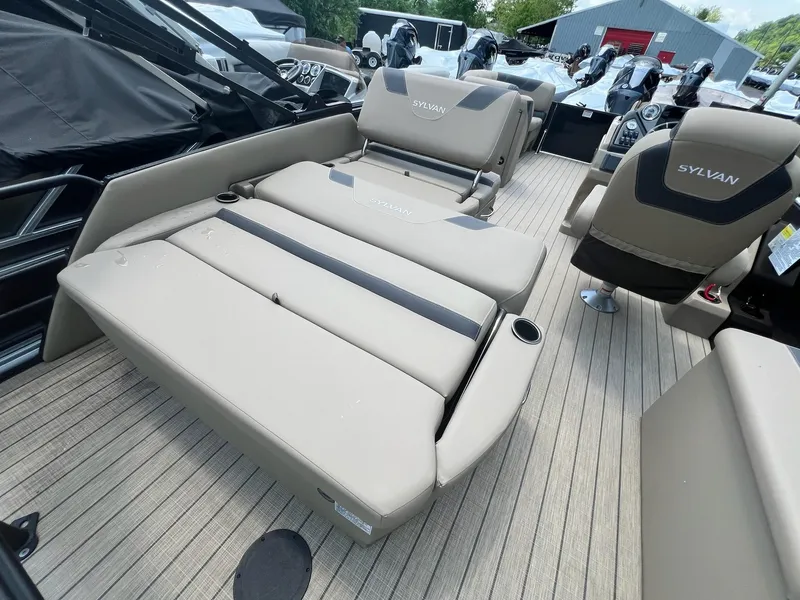 Slide: The Image of 2025 Sylvan L1 DLZ boat interior with beige seating and modern design. - 42