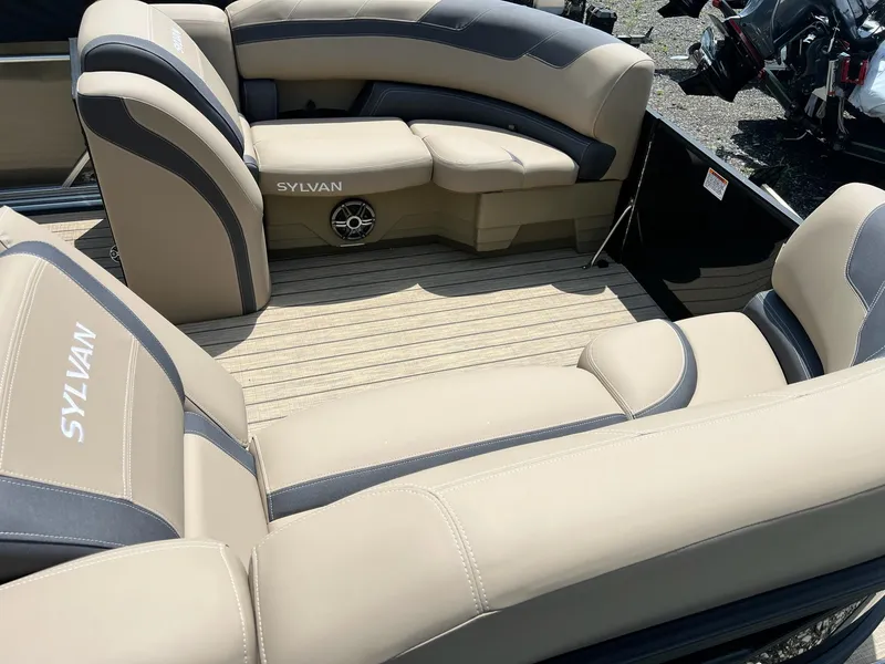 Slide: The Image of 2025 Sylvan L1 DLZ boat interior with beige and gray seating. - 44