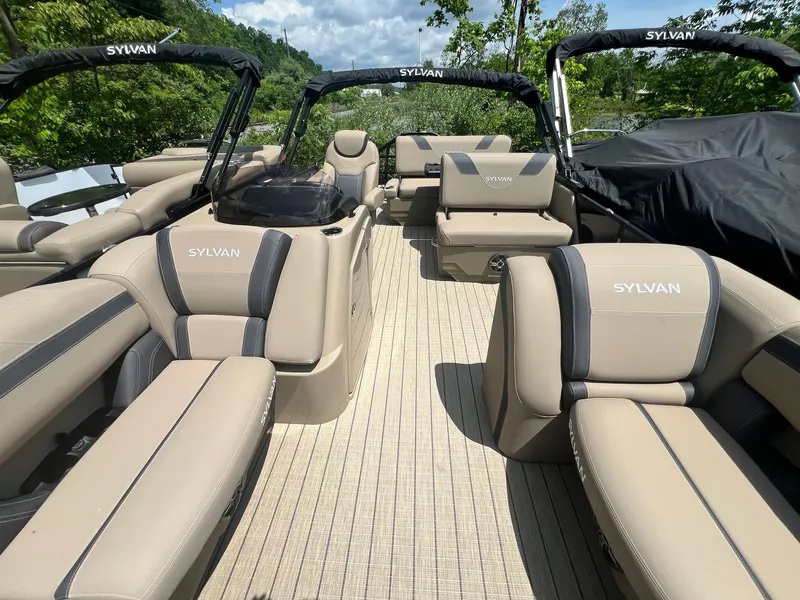 Slide: The Image of 2025 Sylvan L1 DLZ pontoon boat with luxurious seating and sleek design. - 5