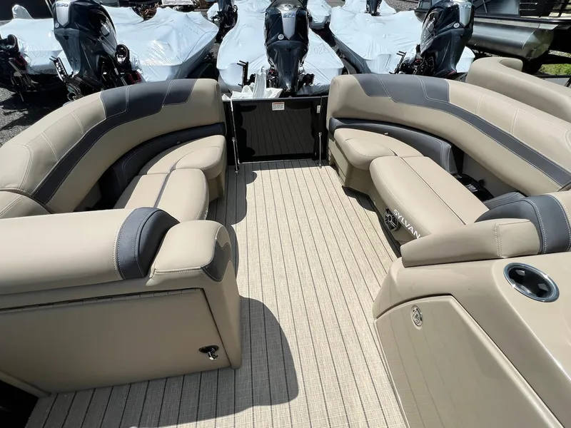 Slide: The Image of 2025 Sylvan L1 DLZ boat interior with beige seating and modern design. - 6