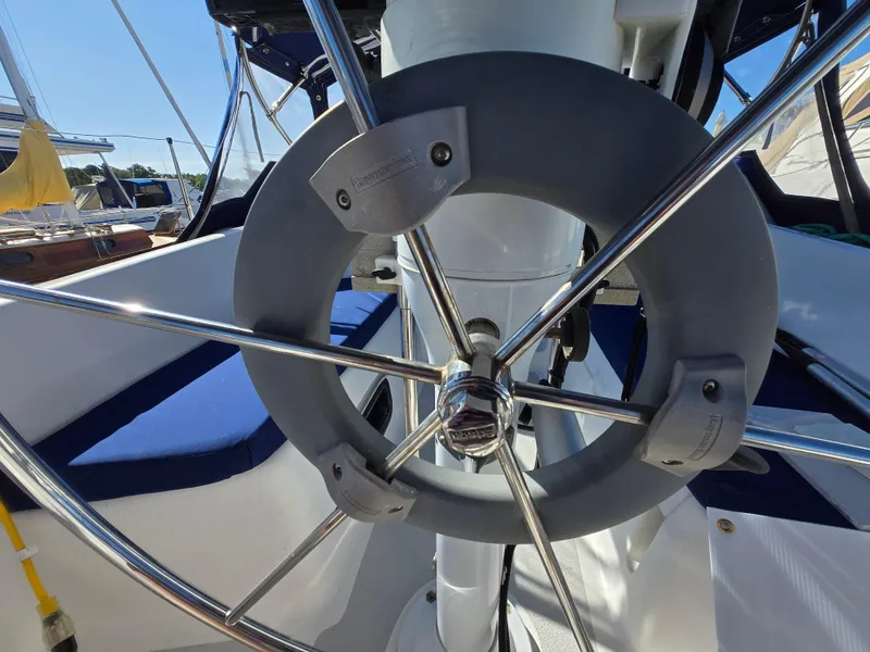 Slide: The Image of Steering wheel of a 1994 Hunter 33.5 sailboat, showcasing stainless steel design. - 11