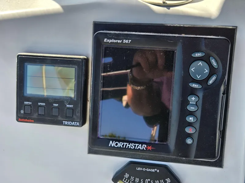 Slide: The Image of Control panel of a 1994 Hunter 33.5 boat with Northstar Explorer 567 and Tridata displays. - 19