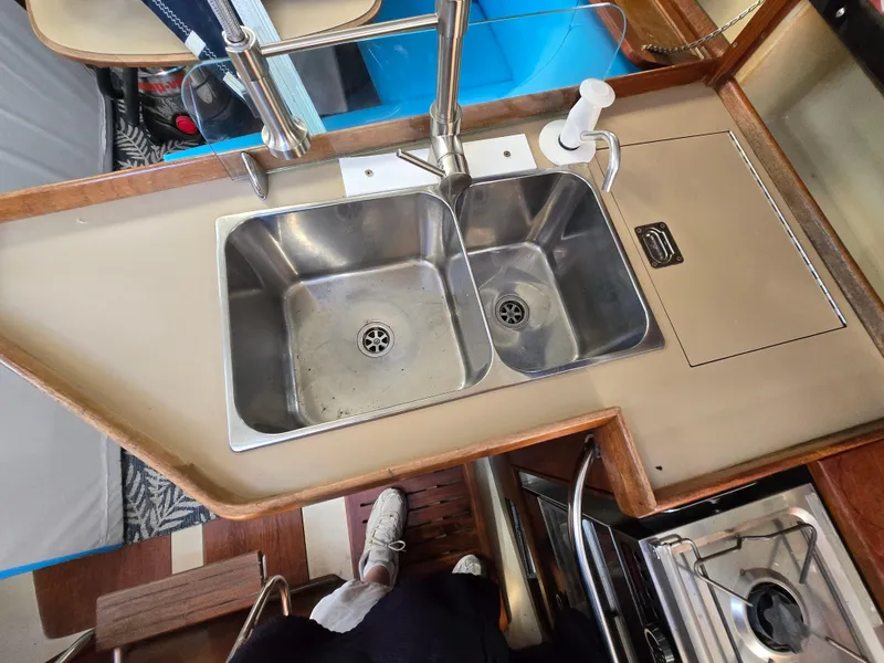 Slide: The Image of Hunter 33.5 sailboat kitchen sink and stove, 1994 model interior view. - 23