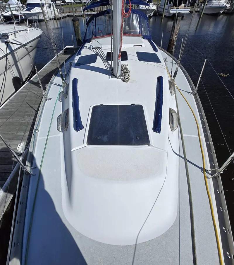 Slide: The Image of 1994 Hunter 33.5 sailboat docked at marina, top deck view. - 24