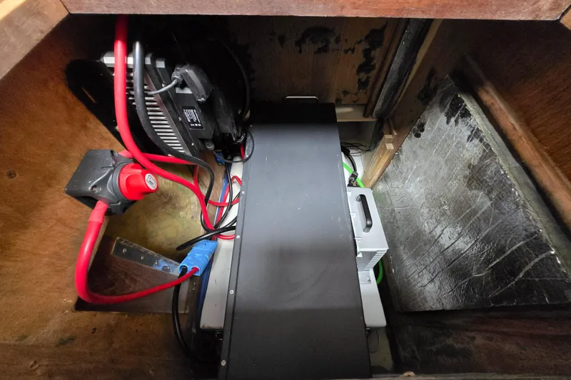 Slide: The Image of Electrical compartment of a 1994 Hunter 33.5 boat with wiring and components. - 50