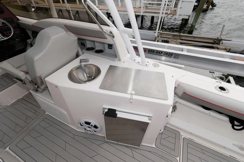 Slide: The Image of 2023 Solara S-250 DC boat interior with sink and storage area. - 12