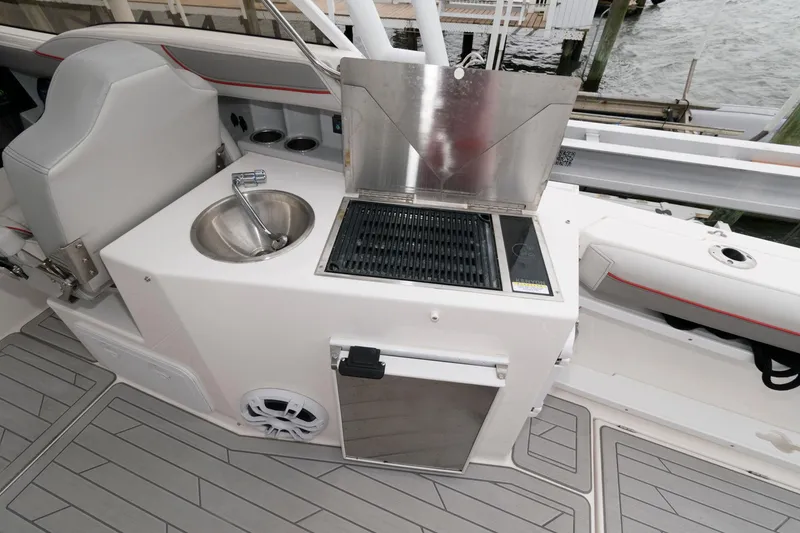 Slide: The Image of Outdoor kitchen on 2023 Solara S-250 DC boat with grill and sink. - 13