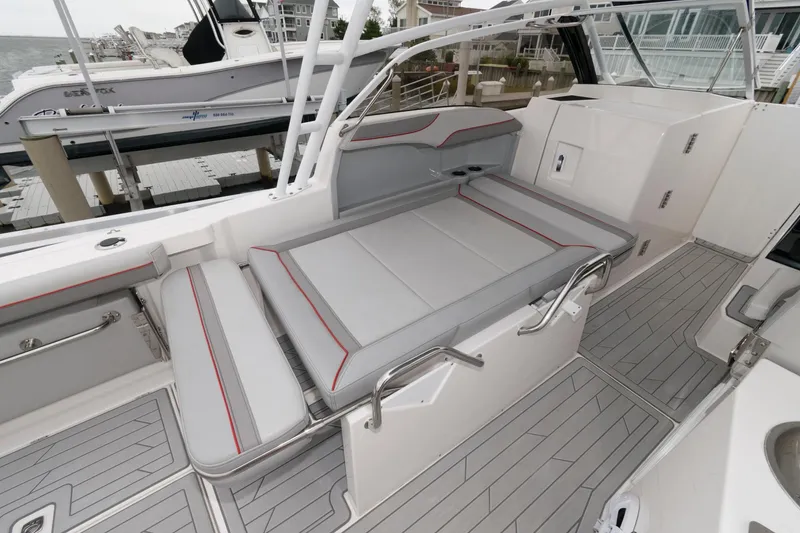 Slide: The Image of 2023 Solara S-250 DC boat interior with gray seating and sleek design. - 15