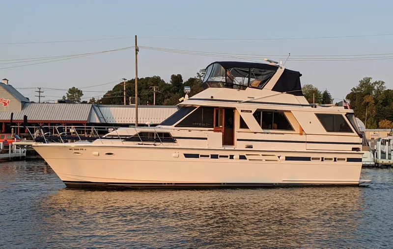 The Image of 1990 Jefferson Marquessa 52 yacht docked at marina, side view. - 0