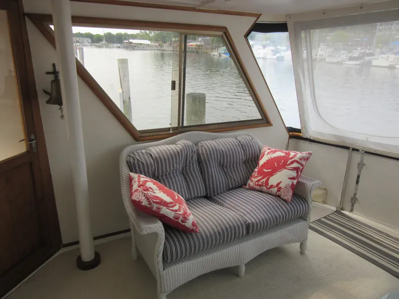 Slide: The Image of Cozy seating area on 1990 Jefferson Marquessa 52 yacht with waterfront view. - 36