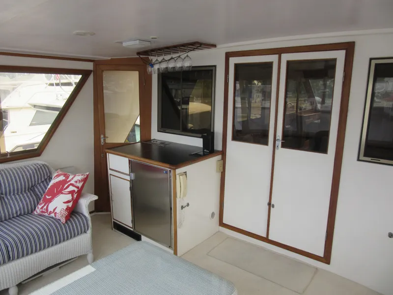 Slide: The Image of Interior of 1990 Jefferson Marquessa 52 yacht with cozy seating and kitchenette. - 38