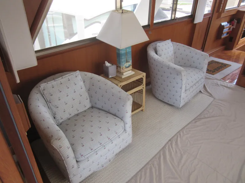 Slide: The Image of Cozy seating area on 1990 Jefferson Marquessa 52 yacht with armchairs and lamp. - 42