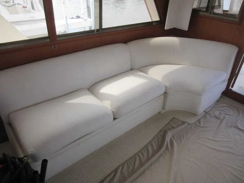 Slide: The Image of White sectional sofa in 1990 Jefferson Marquessa 52 yacht interior. - 43