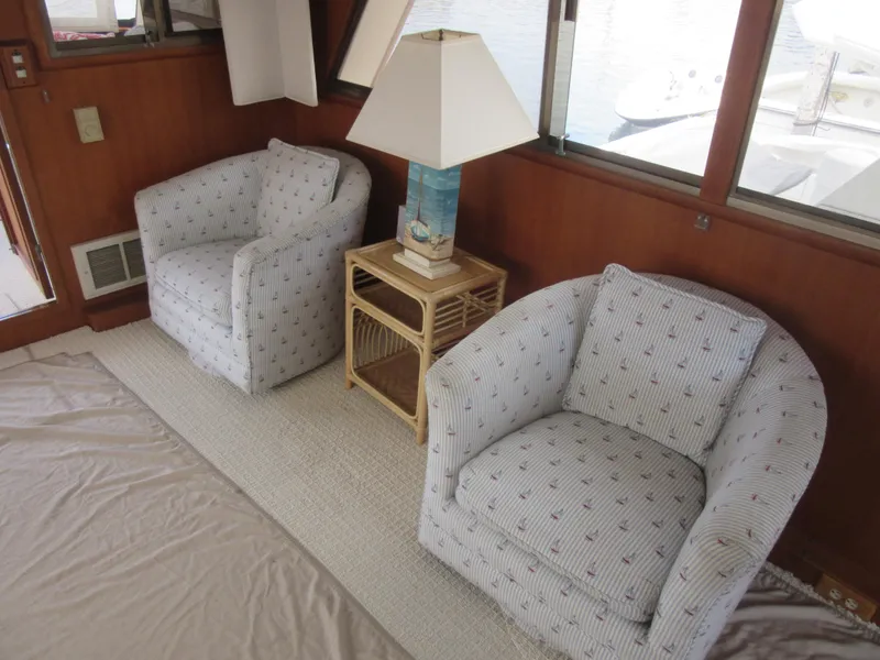 Slide: The Image of Cozy seating area on 1990 Jefferson Marquessa 52 yacht with armchairs and lamp. - 45