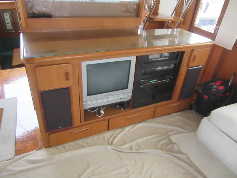 Slide: The Image of Vintage entertainment center in 1990 Jefferson Marquessa 52 yacht interior. - 46