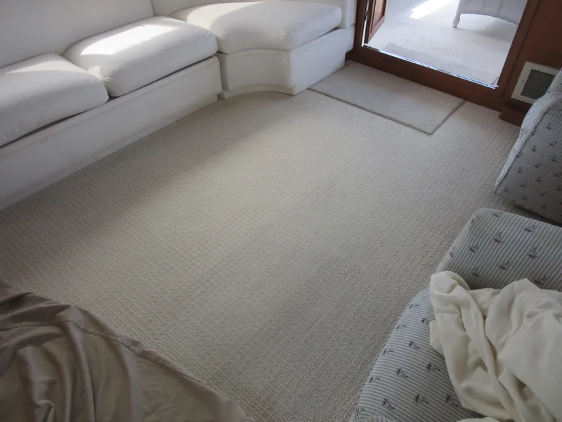 Slide: The Image of Interior of 1990 Jefferson Marquessa 52 yacht with white carpet and seating. - 47
