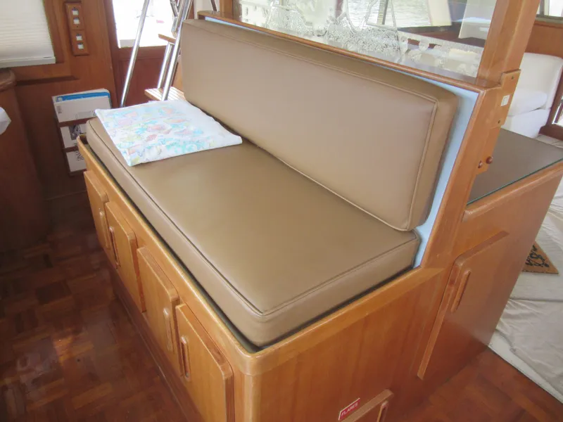 Slide: The Image of Interior seating area on 1990 Jefferson Marquessa 52 yacht with wooden cabinetry. - 48