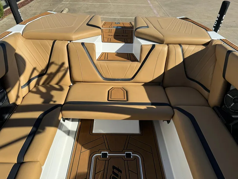 Slide: The Image of 2020 Tigé 23 RZX boat interior with tan leather seating and stylish design. - 10