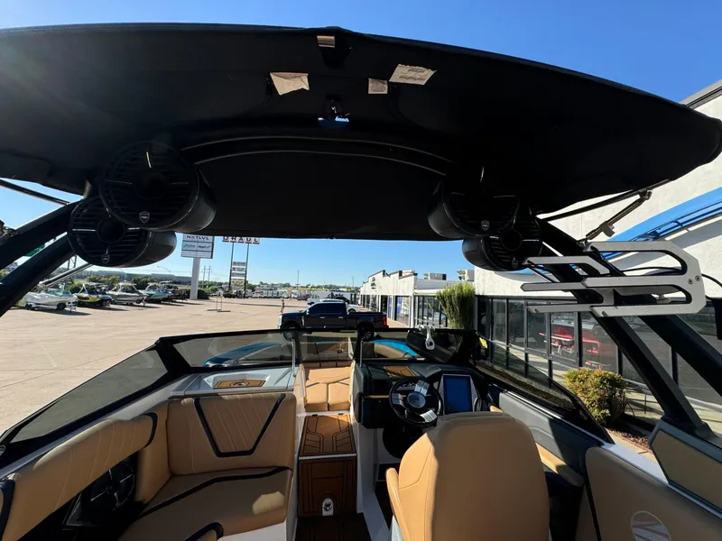 Slide: The Image of Interior view of 2020 Tigé 23 RZX boat with modern dashboard and seating. - 17