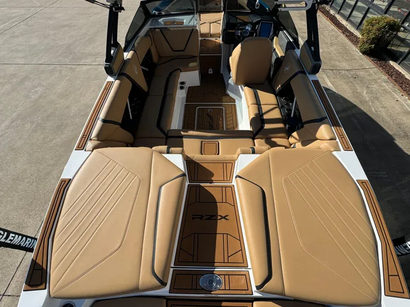 Slide: The Image of 2020 Tigé 23 RZX boat interior with tan seating and sleek design. - 8