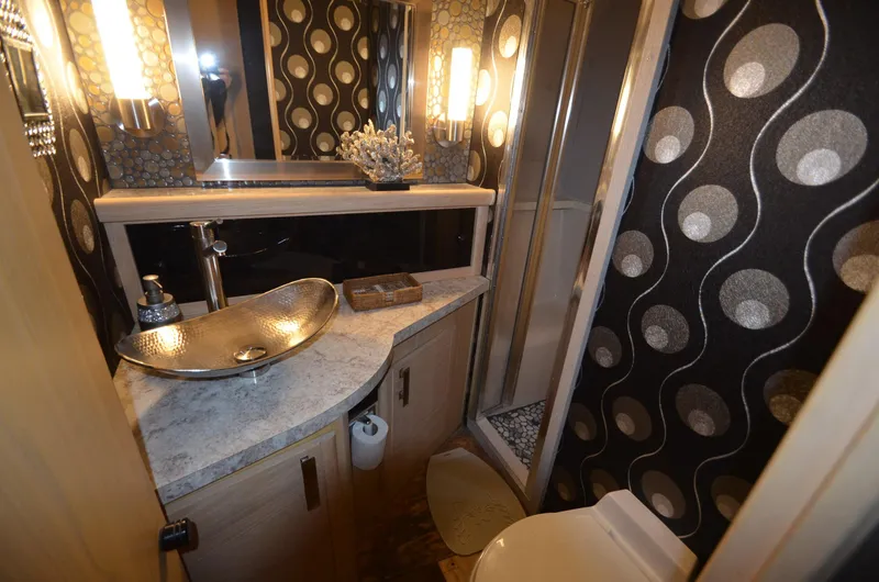 Slide: The Image of Luxurious bathroom in 1989 Silverton Aft Cabin 46 yacht with modern fixtures and stylish decor. - 14