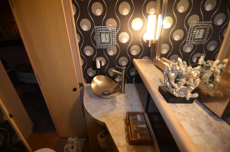 Slide: The Image of Luxurious bathroom in 1989 Silverton Aft Cabin 46 yacht with modern sink and elegant decor. - 16