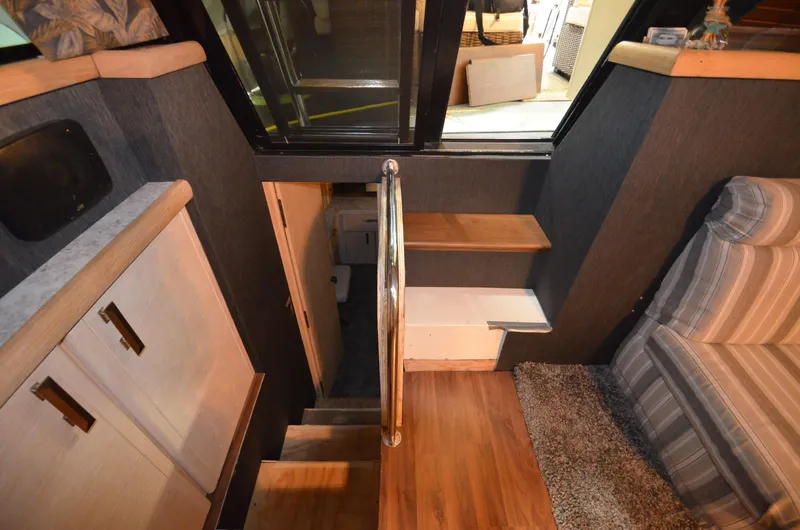 Slide: The Image of Interior of 1989 Silverton Aft Cabin 46 with stairs and seating area. - 18