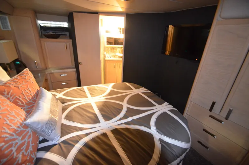 Slide: The Image of 1989 Silverton Aft Cabin 46 bedroom with modern decor and ensuite bathroom. - 20