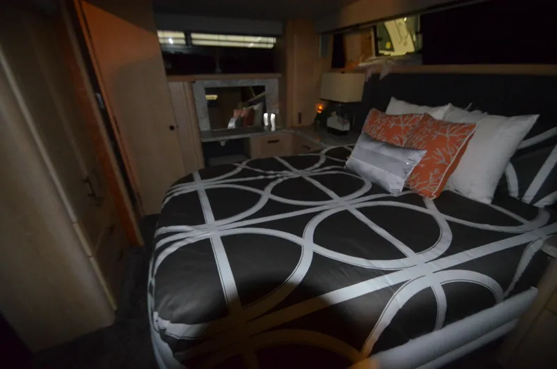 Slide: The Image of 1989 Silverton Aft Cabin 46 bedroom with modern bedding and stylish decor. - 21