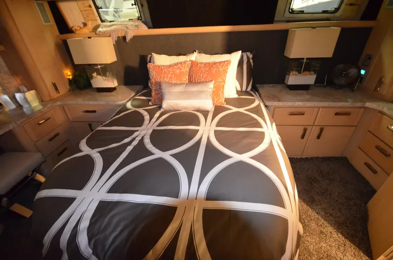 Slide: The Image of Luxurious bedroom in 1989 Silverton Aft Cabin 46 yacht with modern decor and cozy bedding. - 22