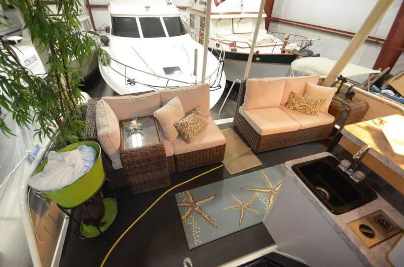 Slide: The Image of Luxurious 1989 Silverton Aft Cabin 46 yacht interior with cozy seating and elegant decor. - 32