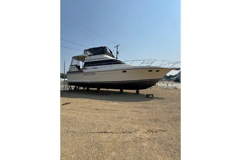 Slide: The Image of 1989 Silverton 46 Aft Cabin yacht on dry dock, side view. - 62