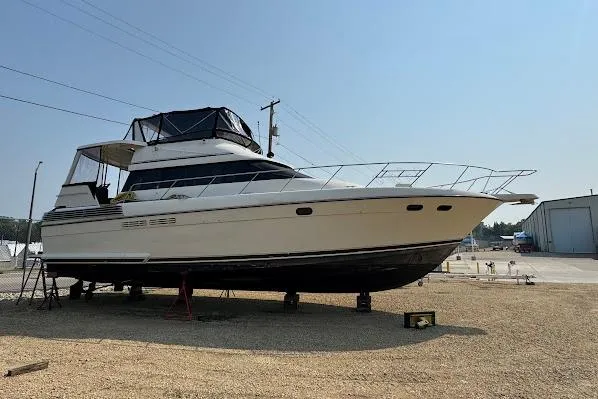 Slide: The Image of 1989 Silverton 46 Aft Cabin yacht on dry dock, side view. - 63