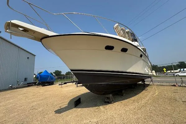 Slide: The Image of 1989 Silverton 46 Aft Cabin yacht on dry dock, side view. - 65