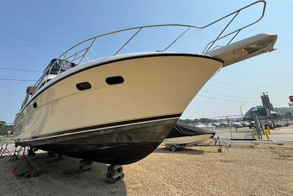 Slide: The Image of 1989 Silverton 46 Aft Cabin yacht on dry dock, side view. - 66