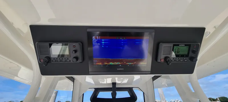 Slide: The Image of 2023 Regulator 34 boat dashboard with navigation and communication systems. - 12