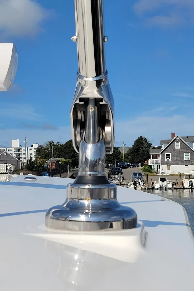 Slide: The Image of 2023 Regulator 34 boat detail with chrome fixture, dockside view. - 19